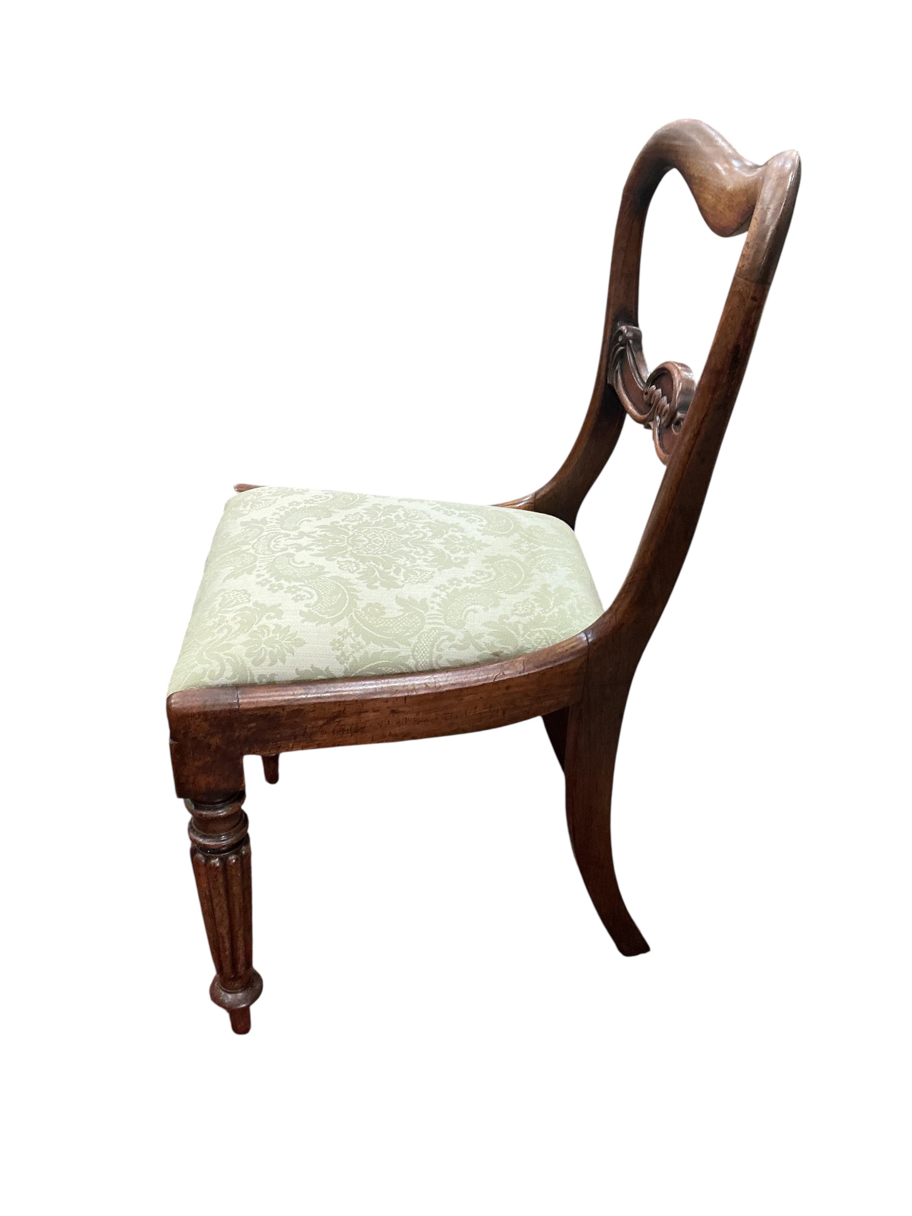 A set of six early Victorian rosewood dining chairs